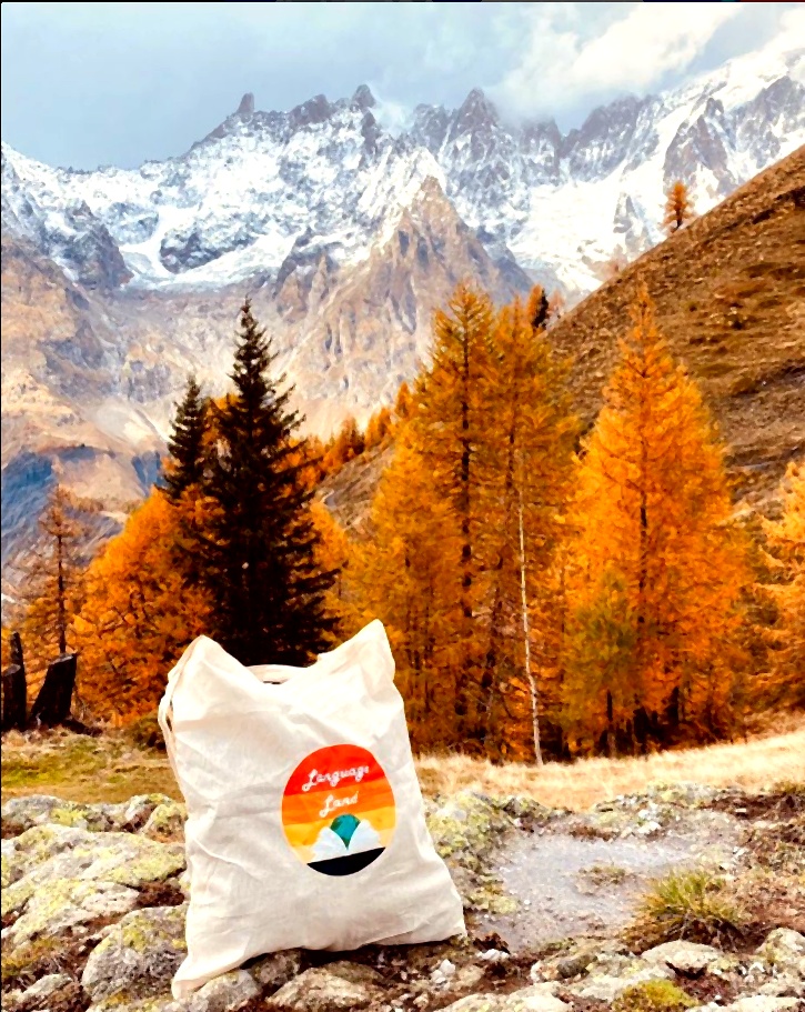 Language Land tote bag in the mountains